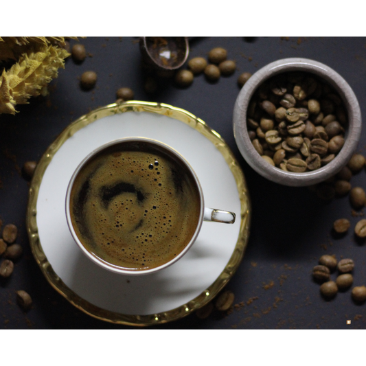 brewed cup of whole bean decaf coffee and coffee beans