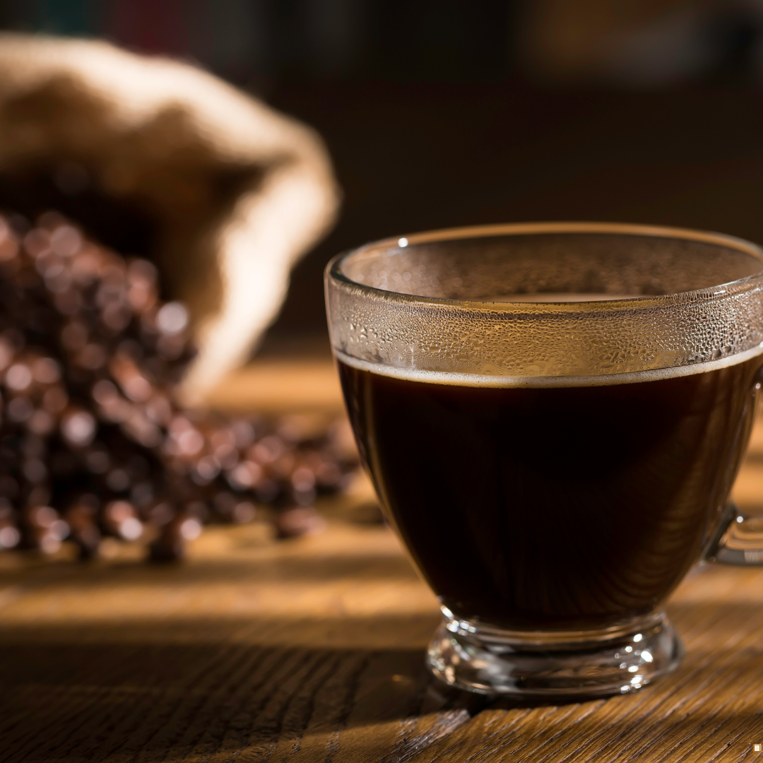 brewed dark roast honduras coffee beans in a cup