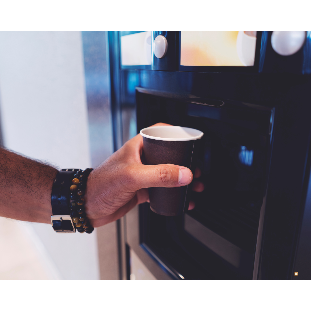 coffee pod subscription filling a cup from machine