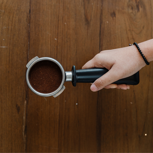 decaf ground coffee in a scoop