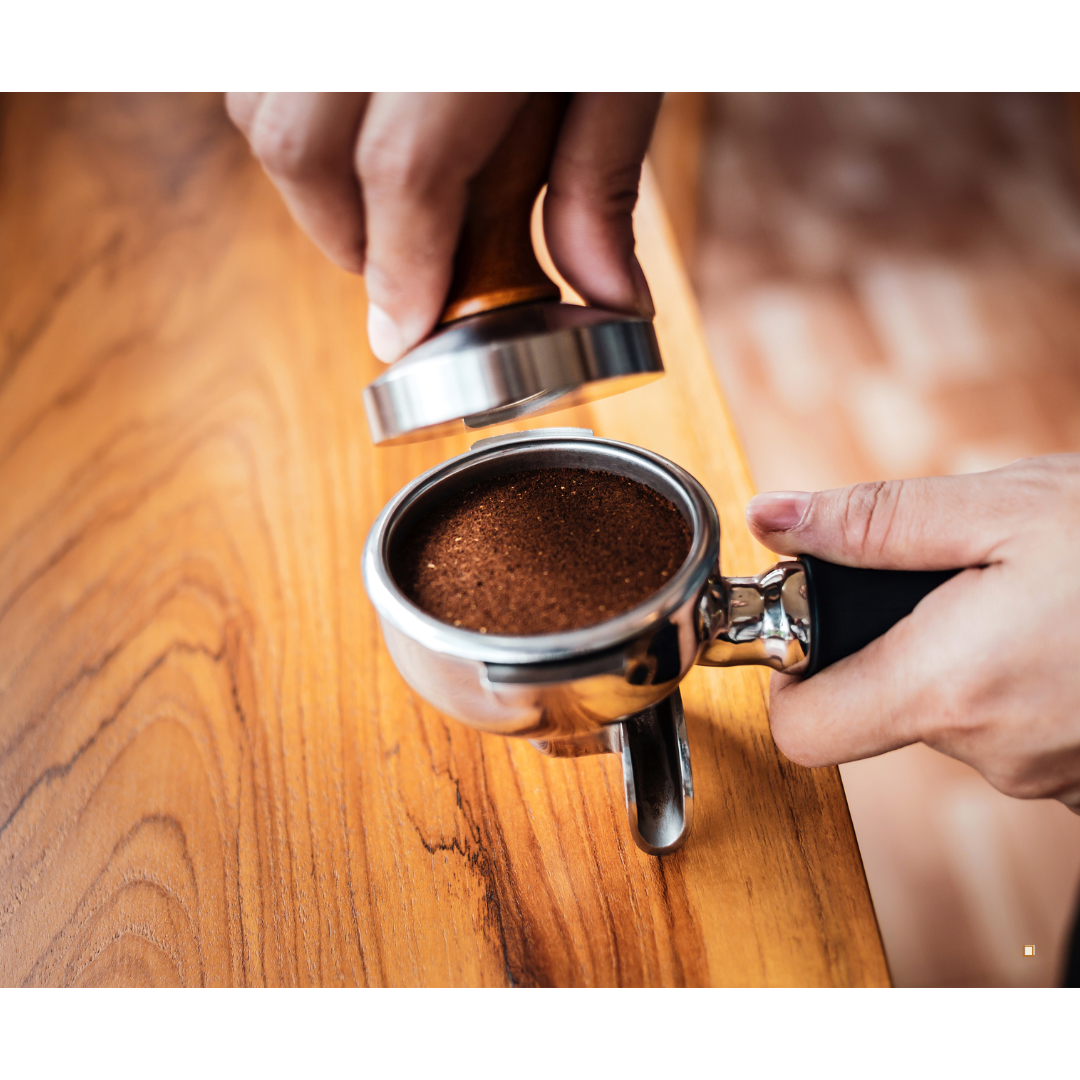 decaf ground coffee in an espresso scoop