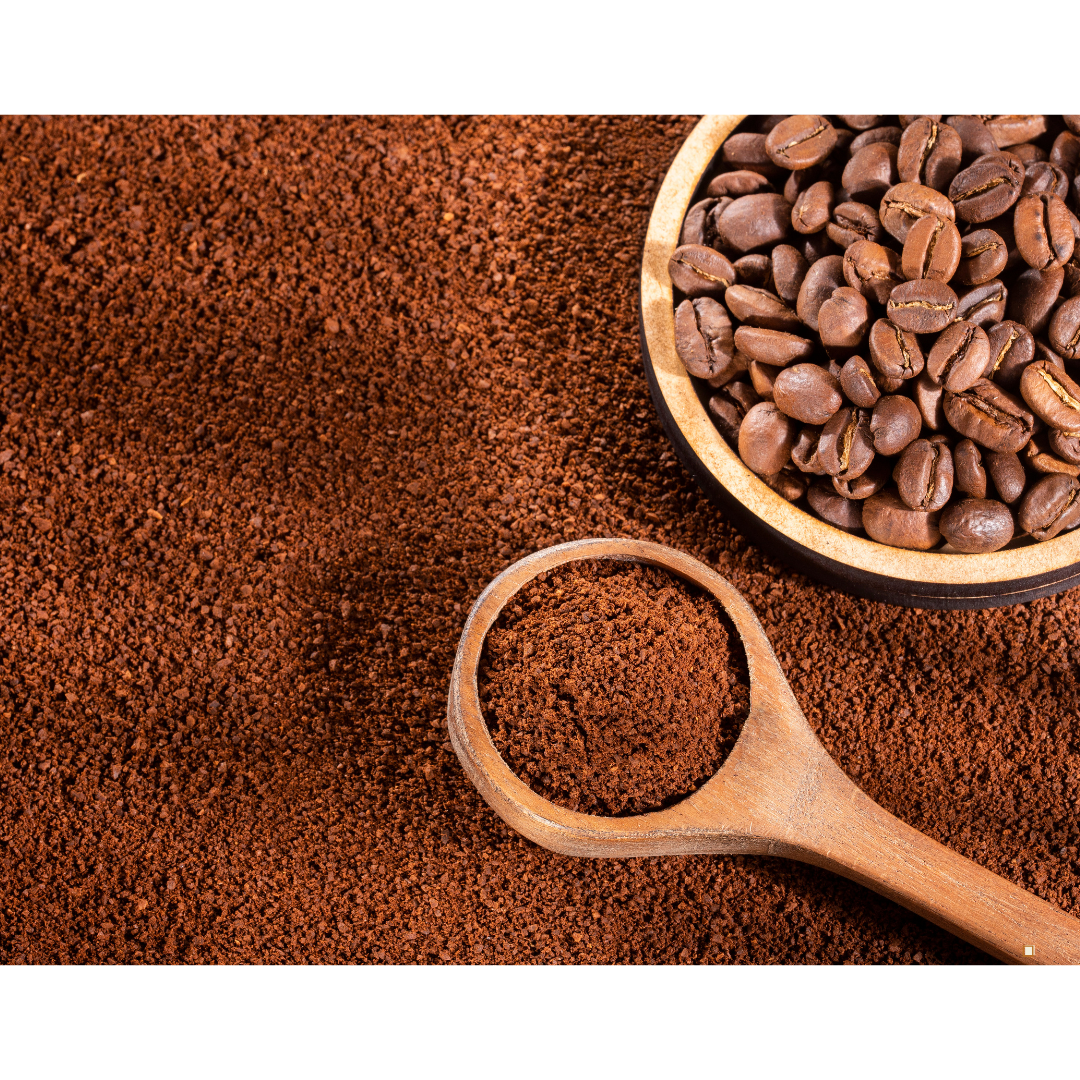 decaf ground coffee with wooden scoop and beans