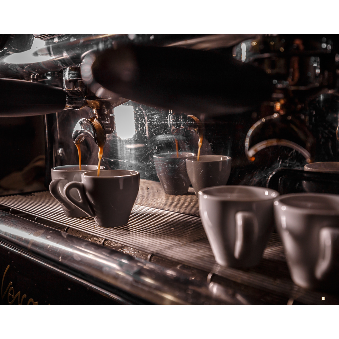 dripping coffee pod subscription machine into ceramic mugs