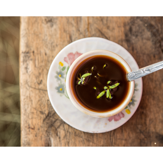 ethiopian yirgacheffee coffee in a cup with a spoon and saucer