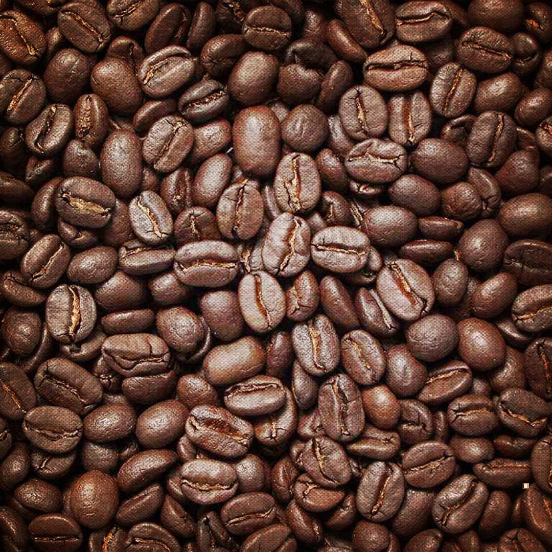 fresh roasted small batch tanzanian peaberry coffee beans closeup