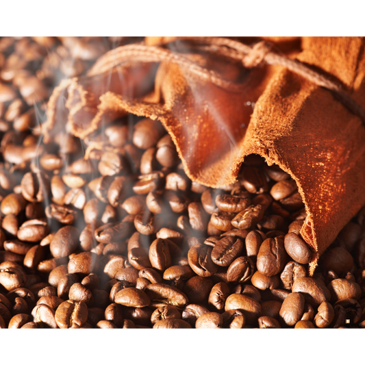 fresh roasted whole bean decaf coffee spilling from coffee bag