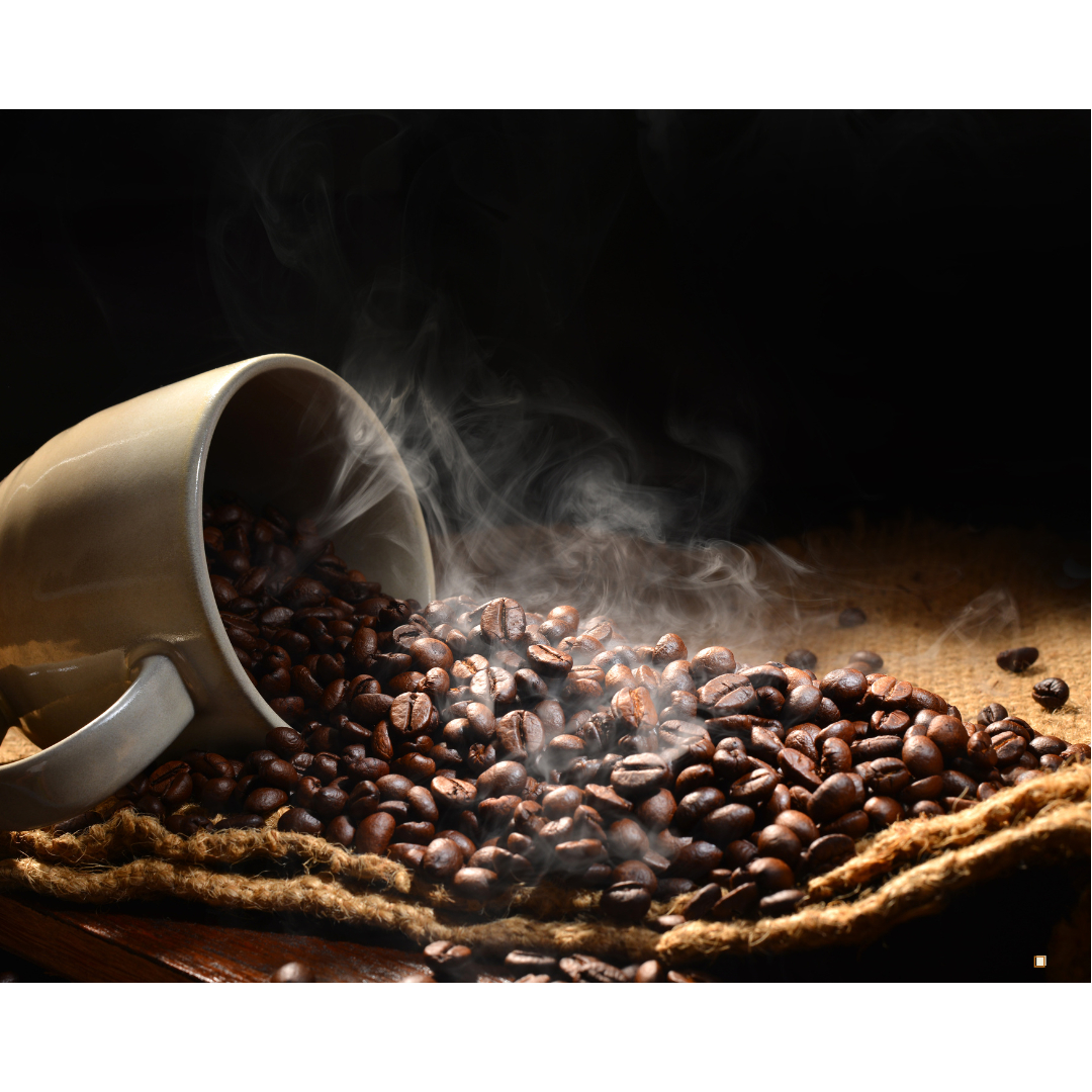 steaming whole bean decaf coffee beans from spilled cup