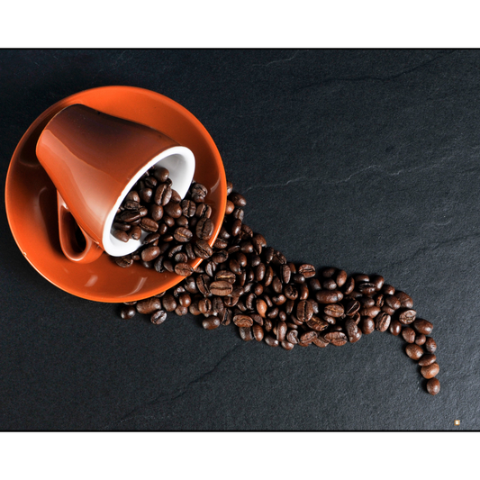 whole bean decaf coffee beans cup and saucer