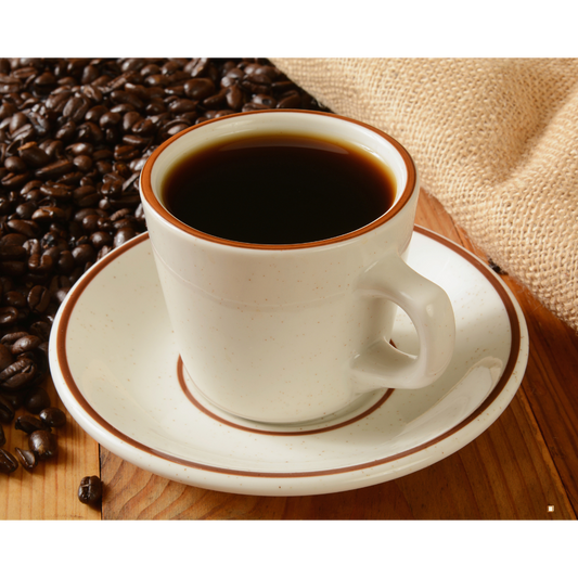 whole bean decaf coffee beans on table with cup of coffee