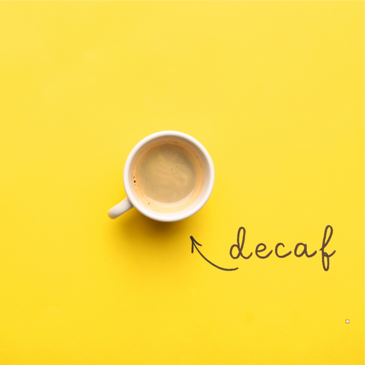whole bean decaf coffee in a cup