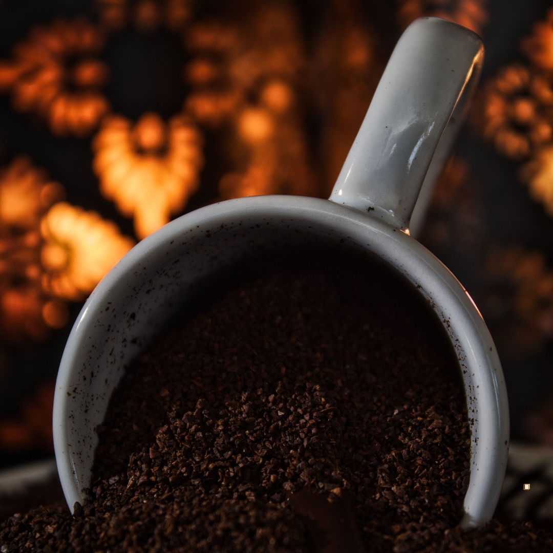 dark roast decaf ground coffee in a ceramic mug