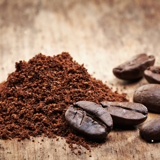decaf ground coffee and whole bean decaf coffee on a wooden table