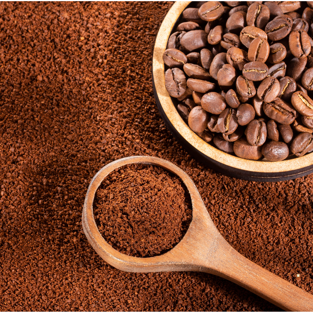 decaf ground coffee grounds and beans with scoop