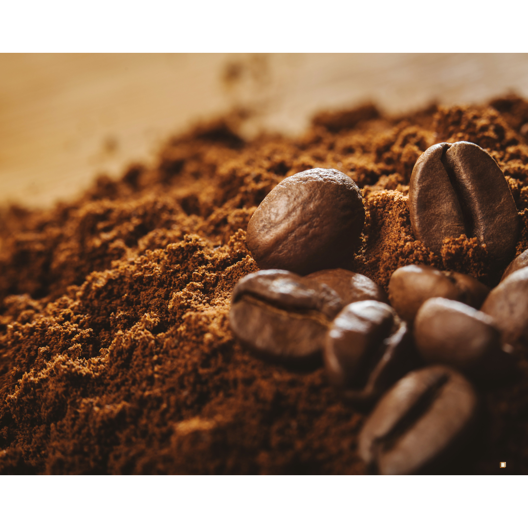 decaf ground coffee mountain with coffee beans at the top