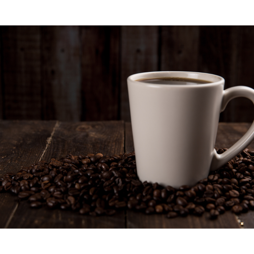 fresh brewed ethiopian yirgacheffe coffee  in a mug surrounded by coffee beans