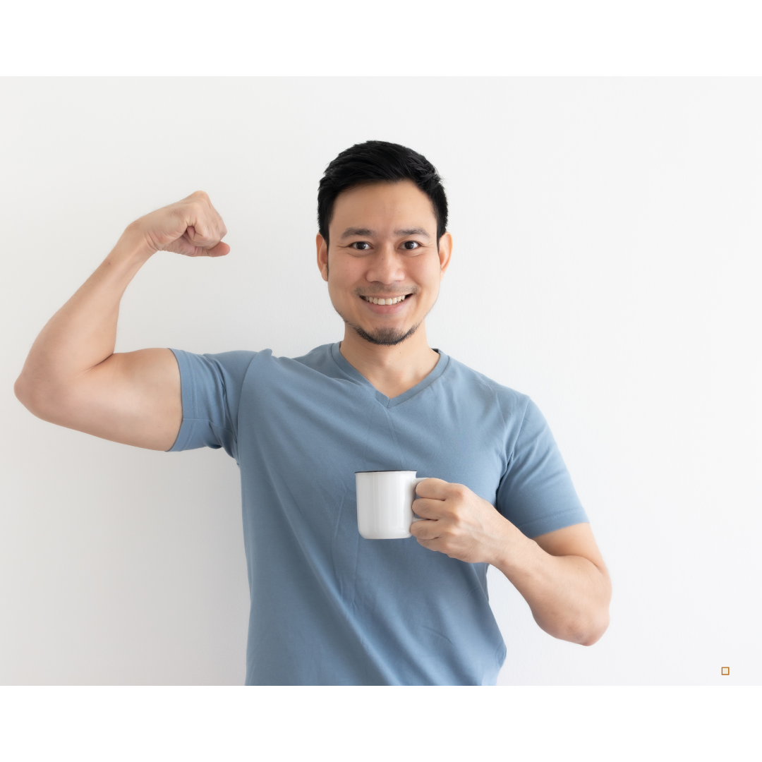 fresh roasted tanzanian peaberry coffee beans in mans coffee cup