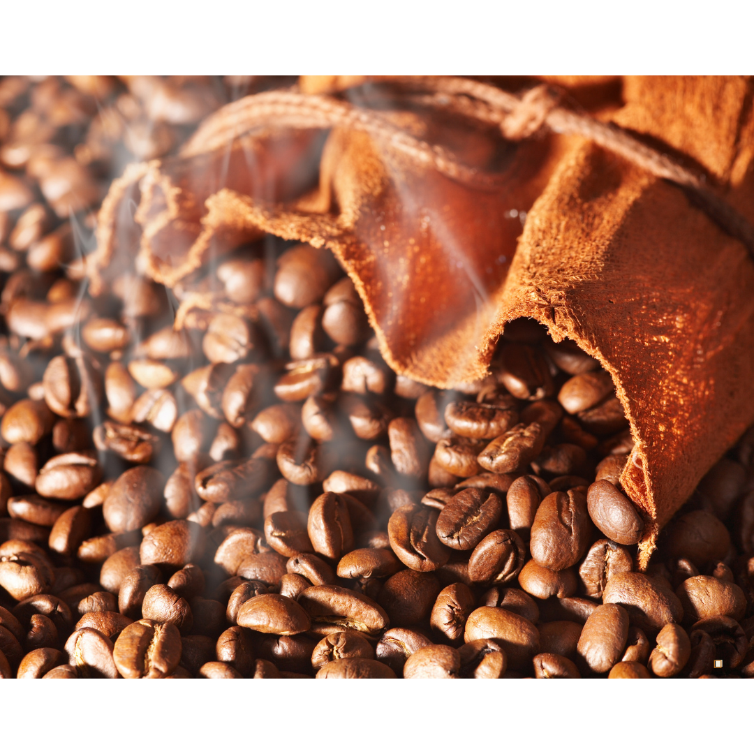 fresh roasted whole bean decaf coffee spilling from coffee bag