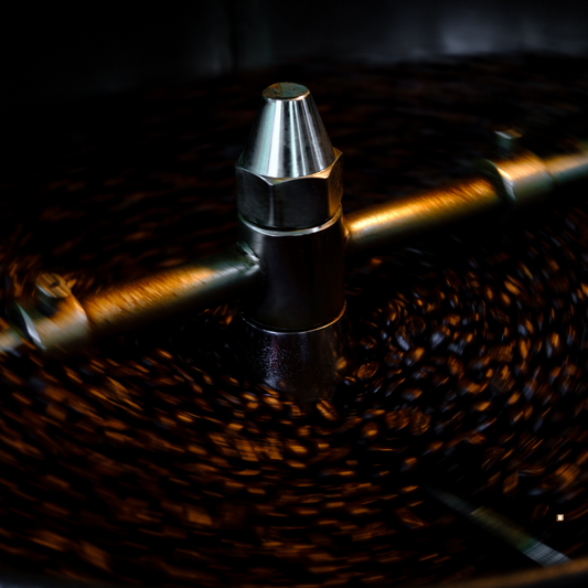 freshly dark roasted small batch coffee in a cooling bin