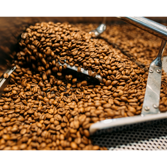 light roast coffee beans being roasted