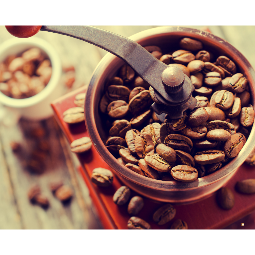 light roasted whole bean decaf coffee in a manual grinder