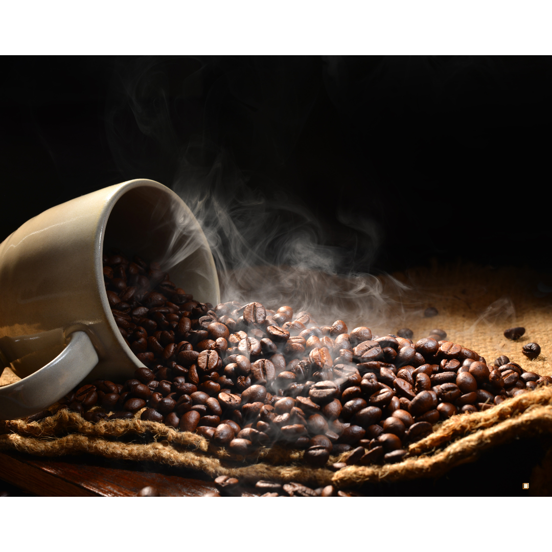 roasted small batch coffee beans emptying from a cup