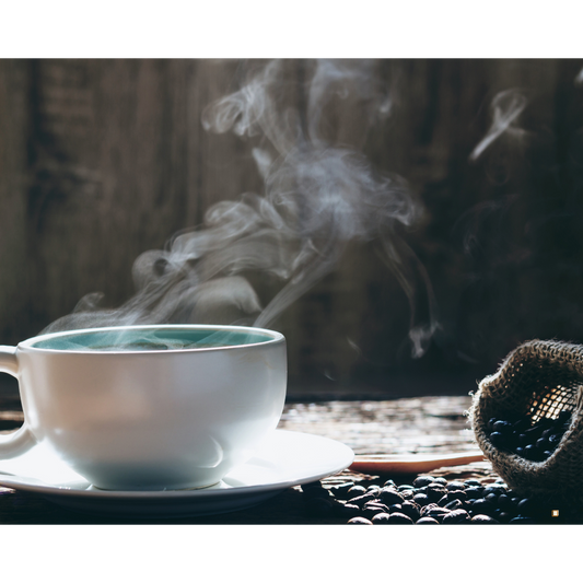 steaming cup of whole bean decaf coffee